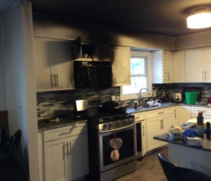 Picture of a Kitchen with smoke and fire damage