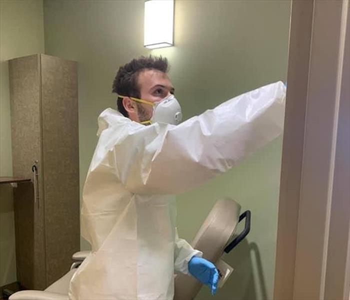 Picture of Employee Cleaning a Hospital